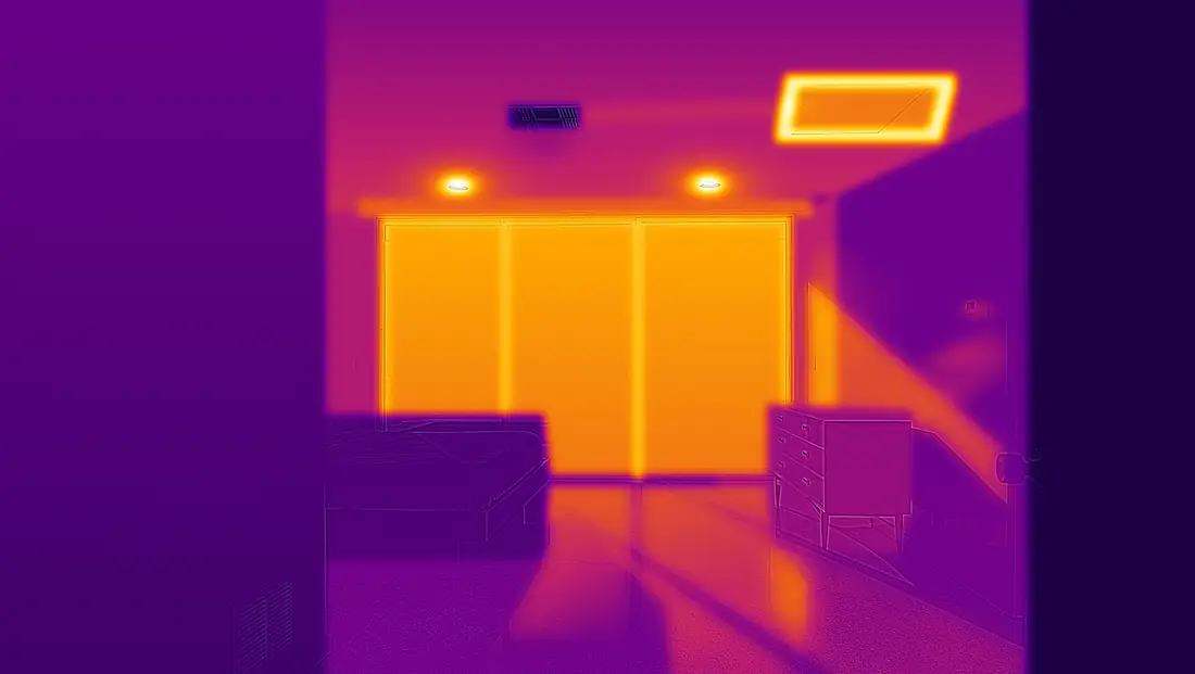 The same room through a thermal camera: the west glass glows orange, the two can lights and the rim of the attic hatch burn yellow, the supply register stays a lukewarm purple, the thermostat sits in a warm stripe of sun, and the door in the foreground is the coolest thing in view.